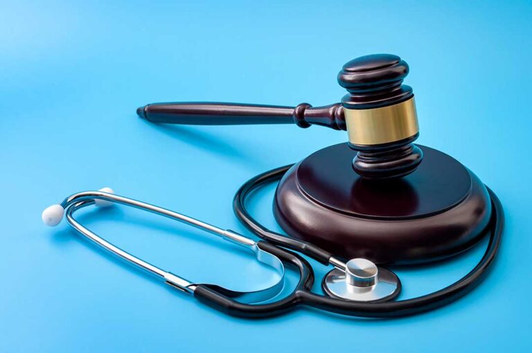 Employee reporting a workplace injury to a supervisor beside a medical form and hard hat. KEYWORDS: ["workplace injury report", "injured employee supervisor", "workers compensation medical care"]